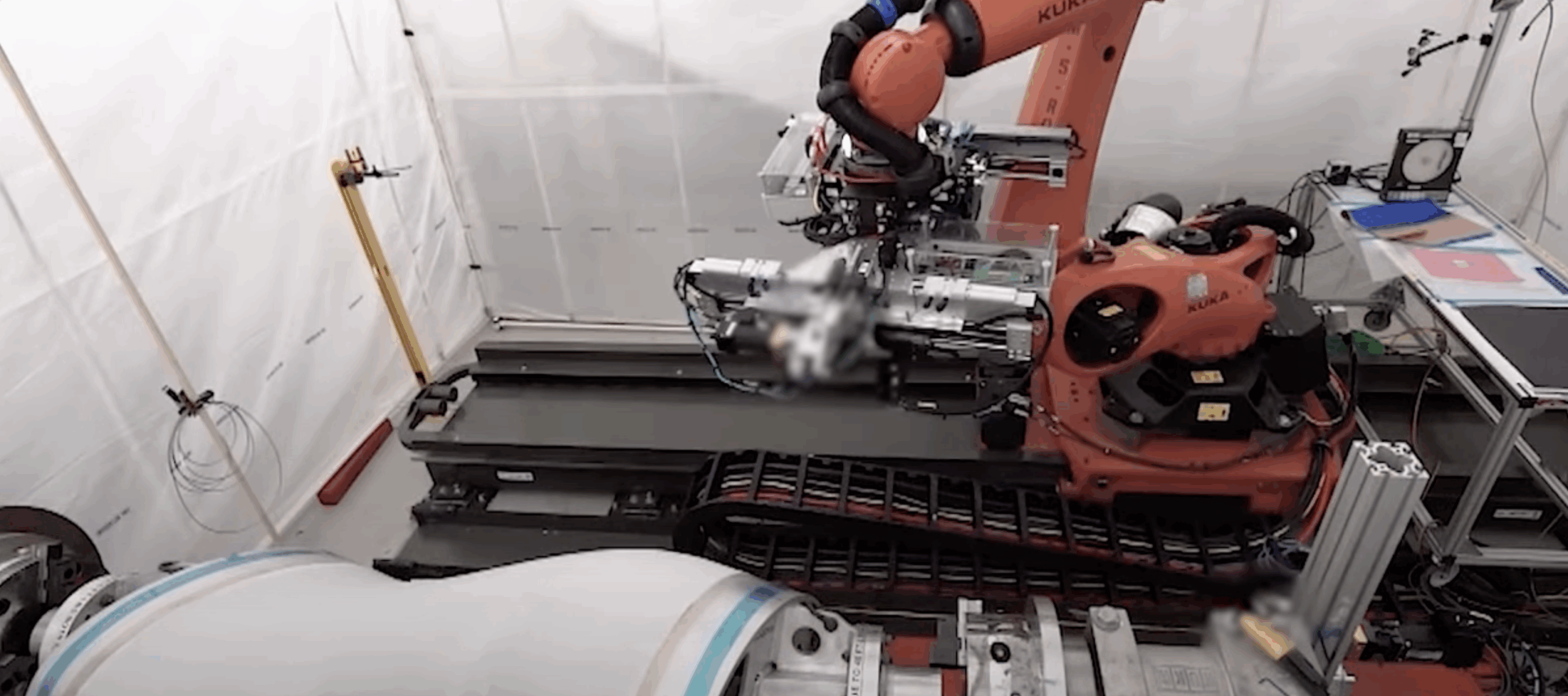 A robotic system completes a composite layup